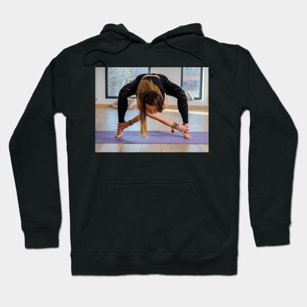 Woman in various yoga postures Hoodie by naturalis